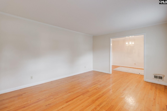 109 Garden Springs Rd, Columbia, SC 29209 - unfurnished room with light wood finished floors, ornamental molding, and a chandelier