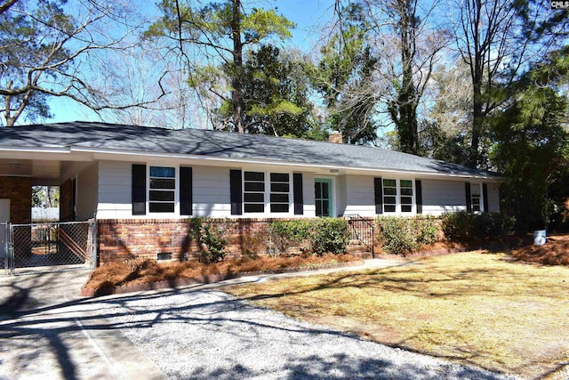 813 Greenlawn Dr, Columbia, SC 29209 - single story home with brick siding, an attached carport, a chimney, and driveway