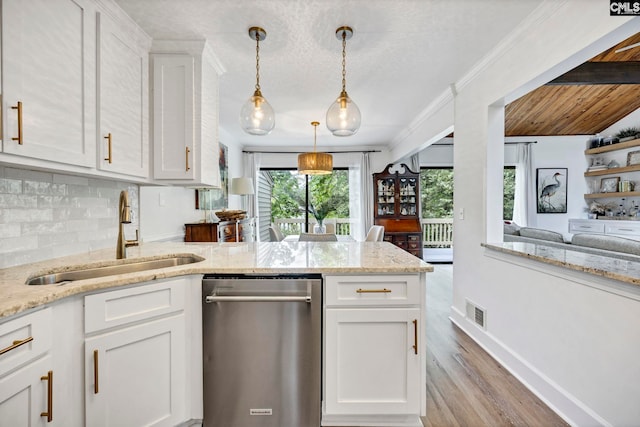 131 Leeward Rd, Columbia, SC 29212 - kitchen featuring stainless steel dishwasher, light wood-style floors, decorative backsplash, white cabinets, and light stone countertops