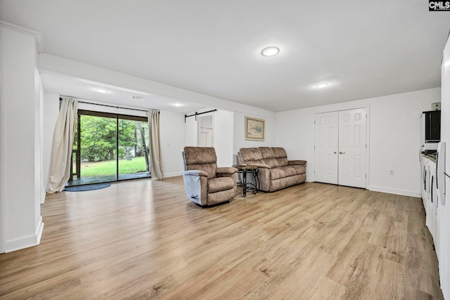 131 Leeward Rd, Columbia, SC 29212 - living room with a barn door, light wood-style flooring, and recessed lighting