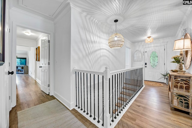 131 Leeward Rd, Columbia, SC 29212 - corridor with wood finished floors, crown molding, and an upstairs landing