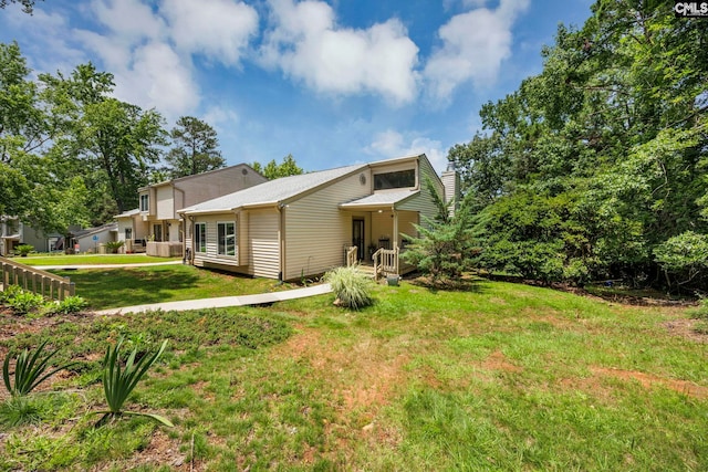 131 Leeward Rd, Columbia, SC 29212 - back of property featuring a lawn and a chimney