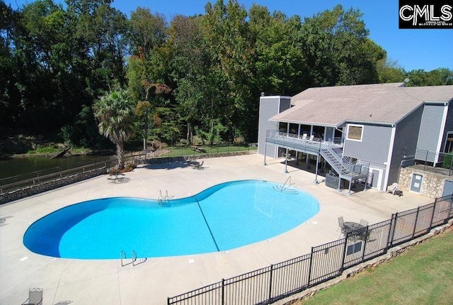 131 Leeward Rd, Columbia, SC 29212 - view of swimming pool with a patio, stairs, and view of scattered trees