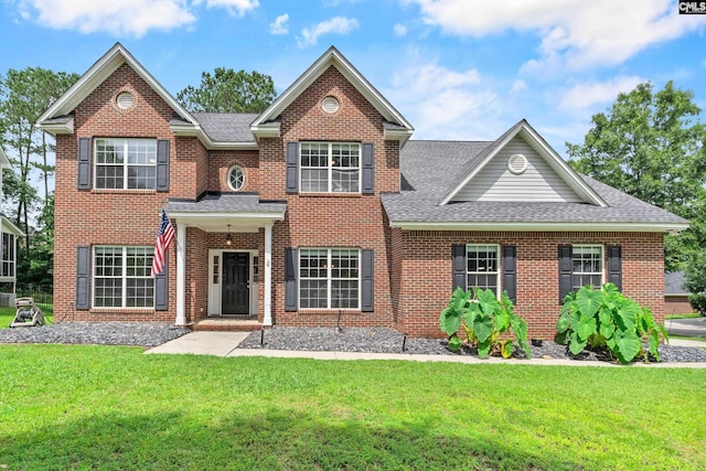 2 Alverston Ct, Irmo, SC 29063 - colonial inspired home featuring a shingled roof, a front lawn, and brick siding