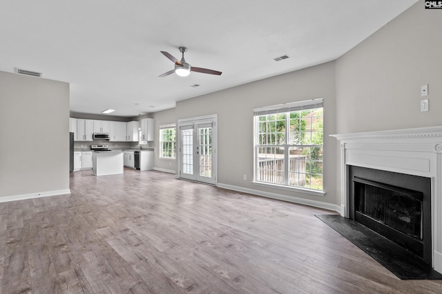 2 Alverston Ct, Irmo, SC 29063 - unfurnished living room with ceiling fan, light wood-style flooring, and a fireplace