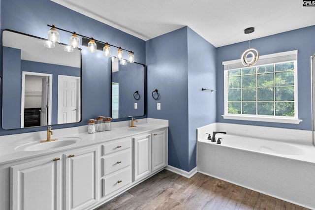 2 Alverston Ct, Irmo, SC 29063 - full bathroom with wood finished floors, double vanity, and a garden tub