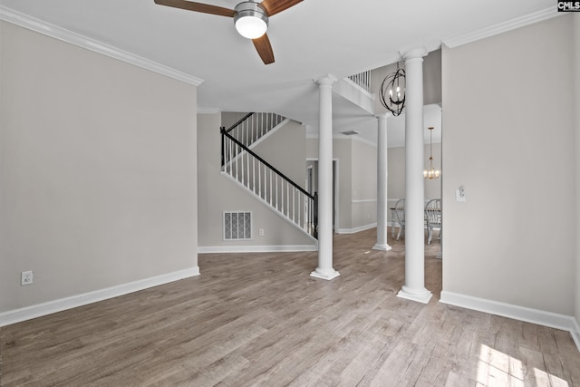 2 Alverston Ct, Irmo, SC 29063 - unfurnished living room with ceiling fan, ornamental molding, stairs, a chandelier, and wood finished floors