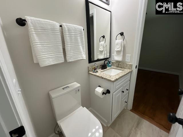 7108 Lou Ln, Columbia, SC 29203 - bathroom with vanity and toilet