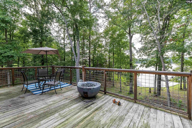 1326 Cedar Cove Rd, Camden, SC 29020 - wooden deck featuring outdoor dining space and view of scattered trees