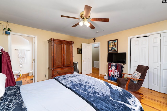 1326 Cedar Cove Rd, Camden, SC 29020 - bedroom with light wood-style floors, a closet, ceiling fan, and connected bathroom