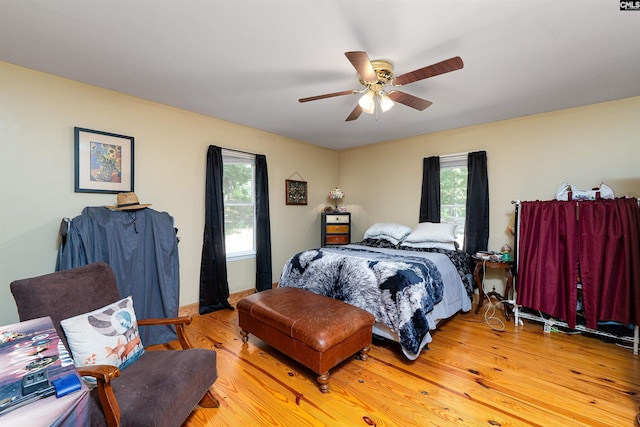 1326 Cedar Cove Rd, Camden, SC 29020 - bedroom with multiple windows, light wood-type flooring, and a ceiling fan