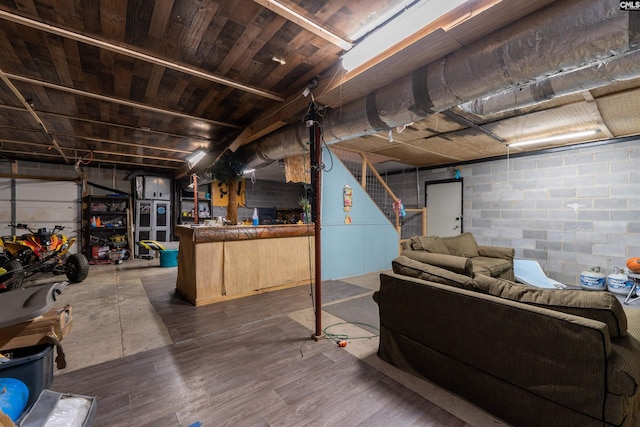 1326 Cedar Cove Rd, Camden, SC 29020 - below grade area with stairs, concrete block wall, bar, and dark wood-type flooring