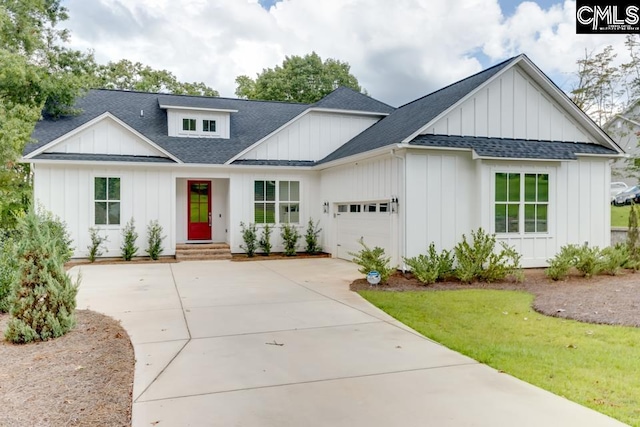 196 Osprey Pointe Ln, Prosperity, SC 29127 - modern inspired farmhouse with board and batten siding, a shingled roof, a garage, and driveway