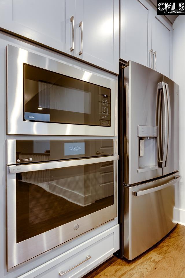 196 Osprey Pointe Ln, Prosperity, SC 29127 - kitchen view of appliances with stainless steel finishes and light wood-style floors