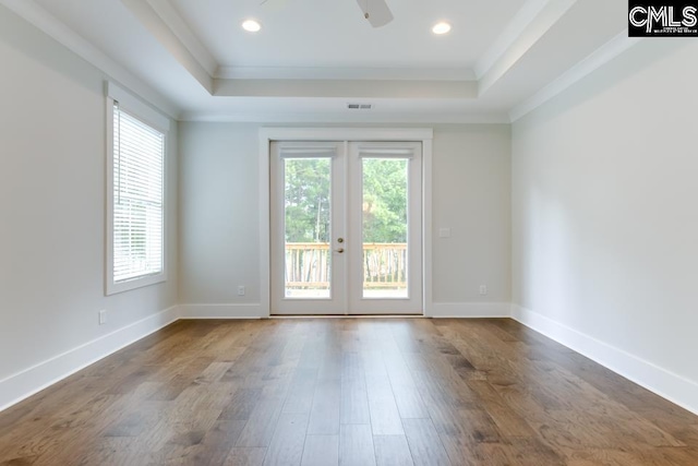 196 Osprey Pointe Ln, Prosperity, SC 29127 - spare room featuring a raised ceiling, healthy amount of natural light, french doors, ornamental molding, and recessed lighting