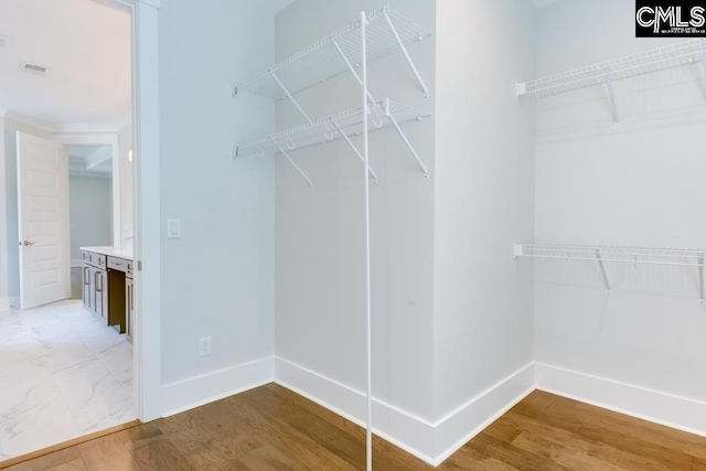 196 Osprey Pointe Ln, Prosperity, SC 29127 - spacious closet featuring wood finished floors