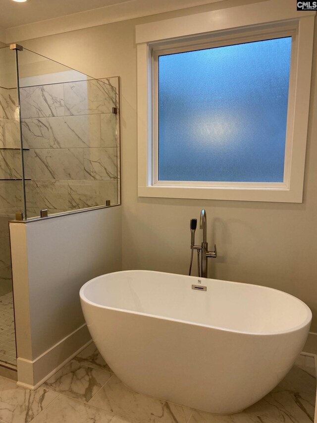 196 Osprey Pointe Ln, Prosperity, SC 29127 - full bathroom featuring marble look tiles, walk in shower, and a freestanding bath