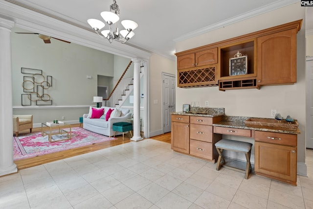 5 Shaftesbury Ln, Columbia, SC 29209 - office area with decorative columns, crown molding, built in study area, a chandelier, and light tile patterned flooring