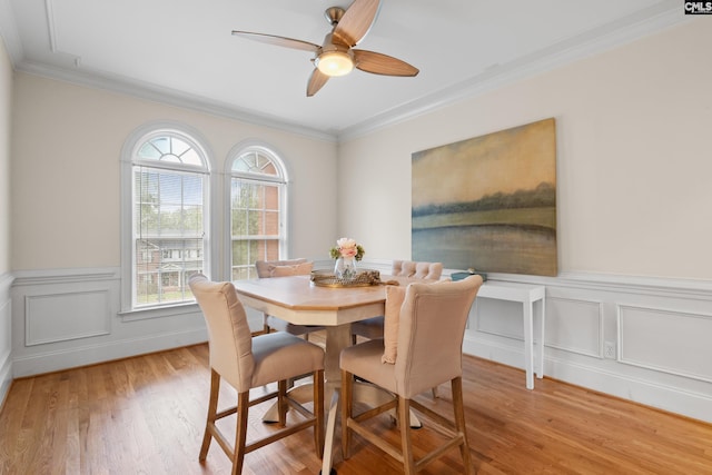 5 Shaftesbury Ln, Columbia, SC 29209 - dining room featuring ornamental molding, light wood-style flooring, ceiling fan, and a wainscoted wall