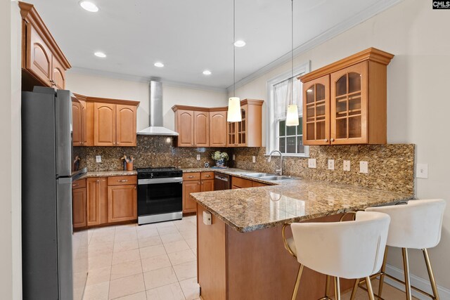 5 Shaftesbury Ln, Columbia, SC 29209 - kitchen with stove, wall chimney range hood, freestanding refrigerator, a peninsula, and crown molding