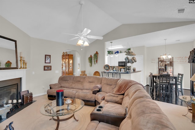 201 Summit Ridge Cir, Columbia, SC 29229 - living area with vaulted ceiling, a chandelier, a ceiling fan, arched walkways, and a fireplace with flush hearth