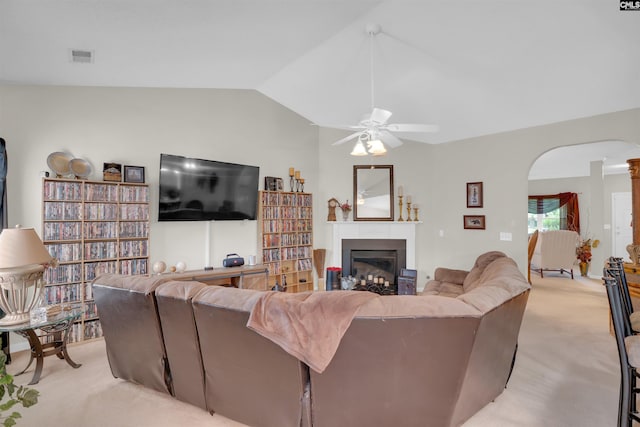 201 Summit Ridge Cir, Columbia, SC 29229 - living room featuring lofted ceiling, light carpet, ceiling fan, arched walkways, and a glass covered fireplace