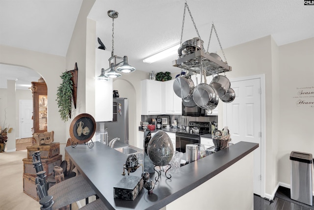 201 Summit Ridge Cir, Columbia, SC 29229 - kitchen featuring black appliances, arched walkways, dark countertops, ornate columns, and white cabinets