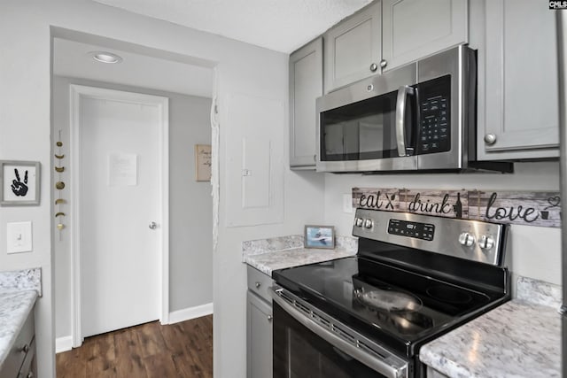 1100 Wheat St Unit 510, Columbia, SC 29201 - kitchen featuring appliances with stainless steel finishes, gray cabinets, and dark wood finished floors