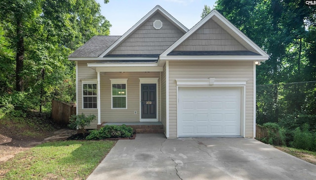 232 Burbank St, Columbia, SC 29210 - view of front of house featuring an attached garage, concrete driveway, and a shingled roof