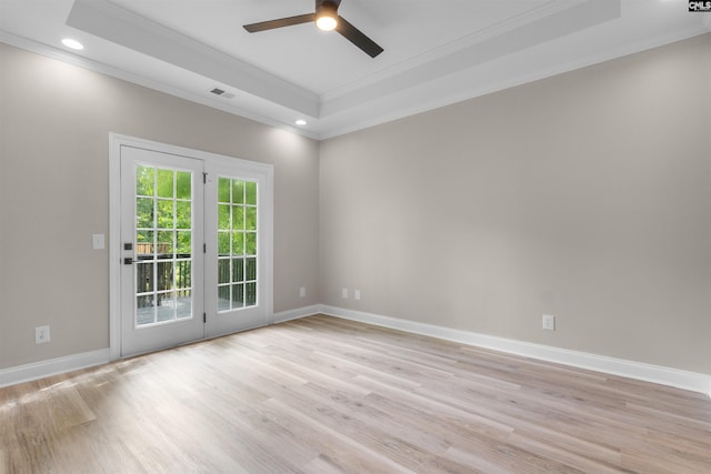 232 Burbank St, Columbia, SC 29210 - spare room with crown molding, a tray ceiling, light wood-style flooring, ceiling fan, and recessed lighting