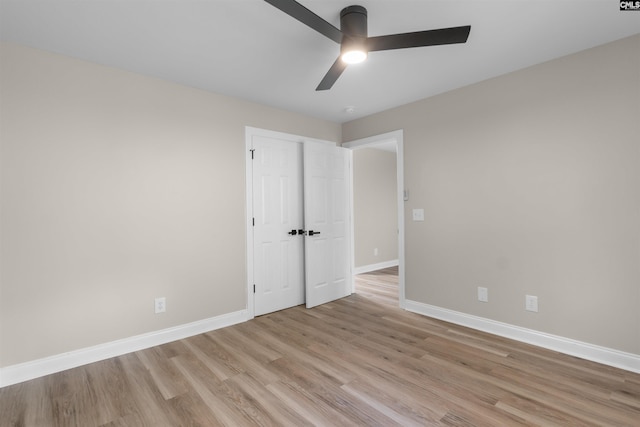 232 Burbank St, Columbia, SC 29210 - unfurnished bedroom featuring light wood finished floors, ceiling fan, and a closet
