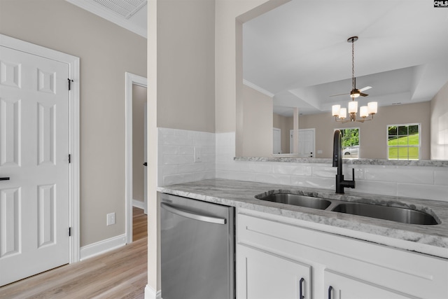 232 Burbank St, Columbia, SC 29210 - kitchen with dishwasher, light wood-style floors, crown molding, a chandelier, and white cabinetry