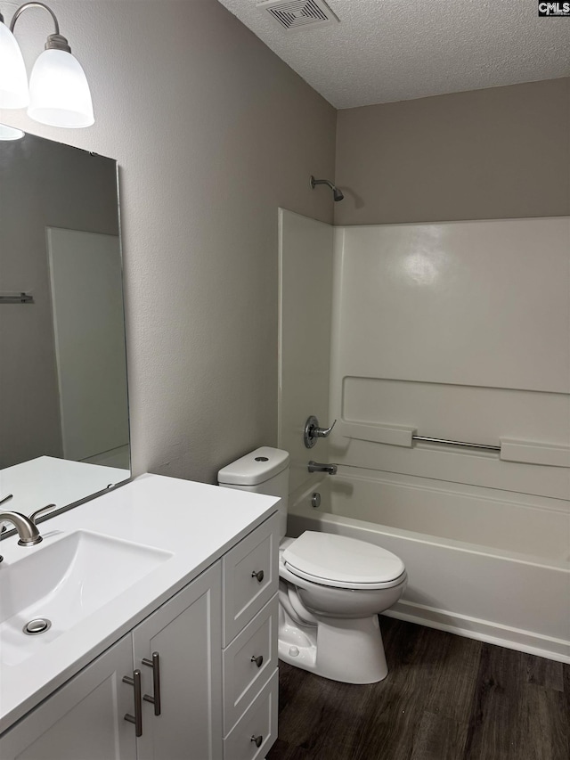 220 Sterling Cross Dr, Columbia, SC 29229 - full bath featuring wood finished floors, vanity, a textured ceiling, and bathing tub / shower combination