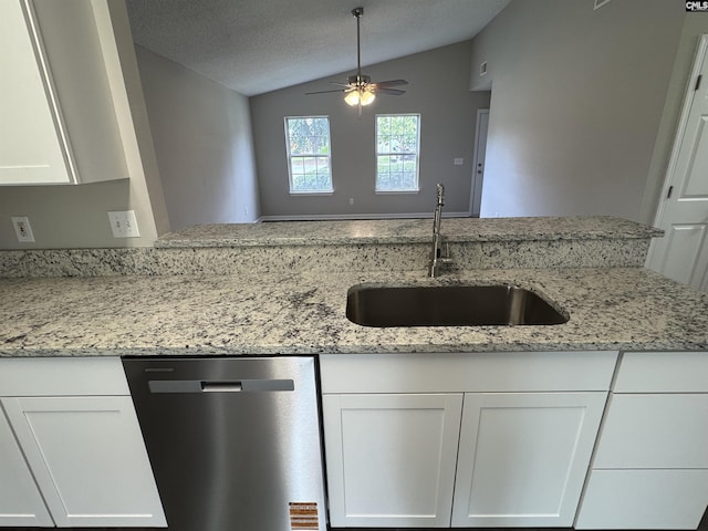 220 Sterling Cross Dr, Columbia, SC 29229 - kitchen with stainless steel dishwasher, lofted ceiling, white cabinets, ceiling fan, and light stone countertops