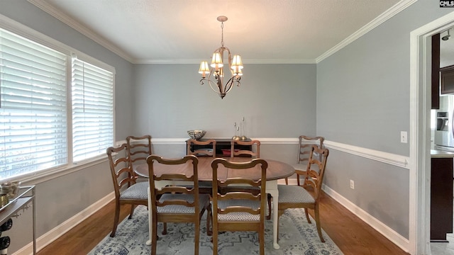 6965 Shelley Rd, Columbia, SC 29209 - dining area with wood finished floors, a chandelier, and ornamental molding