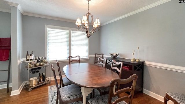 6965 Shelley Rd, Columbia, SC 29209 - dining space featuring wood finished floors, ornamental molding, and a chandelier