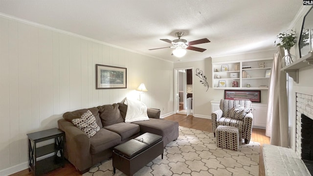 6965 Shelley Rd, Columbia, SC 29209 - living area featuring crown molding, a fireplace, wood finished floors, and ceiling fan
