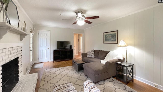 6965 Shelley Rd, Columbia, SC 29209 - living area with wood finished floors, ceiling fan, crown molding, and a brick fireplace