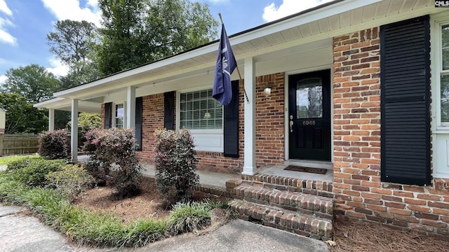 6965 Shelley Rd, Columbia, SC 29209 - doorway to property with brick siding and a porch