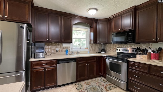 6965 Shelley Rd, Columbia, SC 29209 - kitchen with stainless steel appliances, light countertops, tasteful backsplash, dark brown cabinets, and light tile patterned flooring