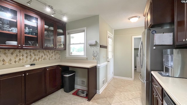 6965 Shelley Rd, Columbia, SC 29209 - kitchen with light countertops, glass insert cabinets, and light tile patterned flooring