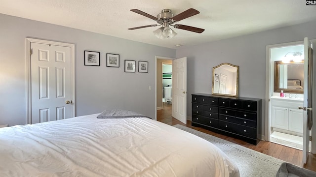 6965 Shelley Rd, Columbia, SC 29209 - bedroom with wood finished floors, ensuite bathroom, and ceiling fan