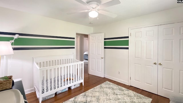 6965 Shelley Rd, Columbia, SC 29209 - bedroom featuring a closet, dark wood-style flooring, ceiling fan, and a nursery area