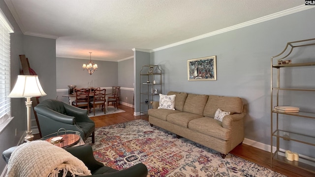 6965 Shelley Rd, Columbia, SC 29209 - living room with a chandelier, wood finished floors, ornamental molding, and a textured ceiling