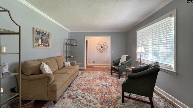 6965 Shelley Rd, Columbia, SC 29209 - living area featuring ornamental molding, a textured ceiling, and wood finished floors