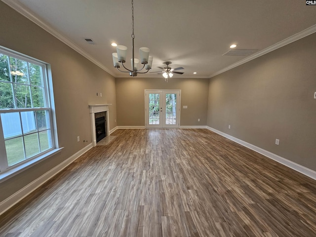 2101 Durham Dr, West Columbia, SC 29170 - unfurnished living room with recessed lighting, dark wood-type flooring, a chandelier, crown molding, and a tiled fireplace