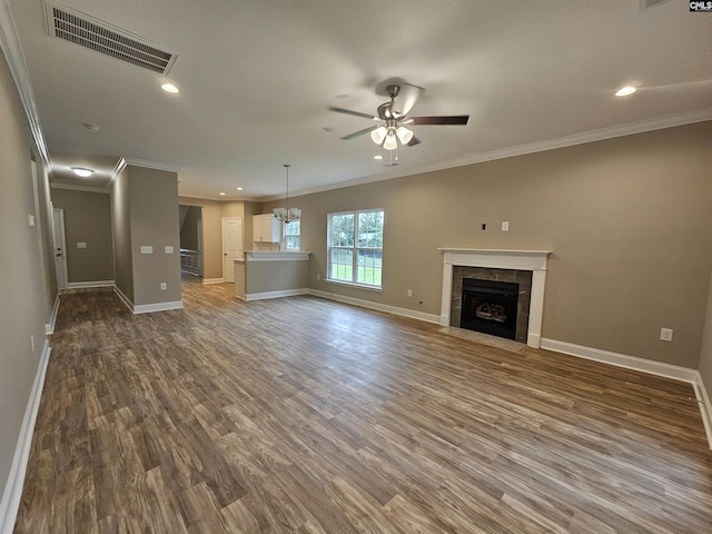 2101 Durham Dr, West Columbia, SC 29170 - unfurnished living room featuring a ceiling fan, ornamental molding, wood finished floors, a tile fireplace, and recessed lighting