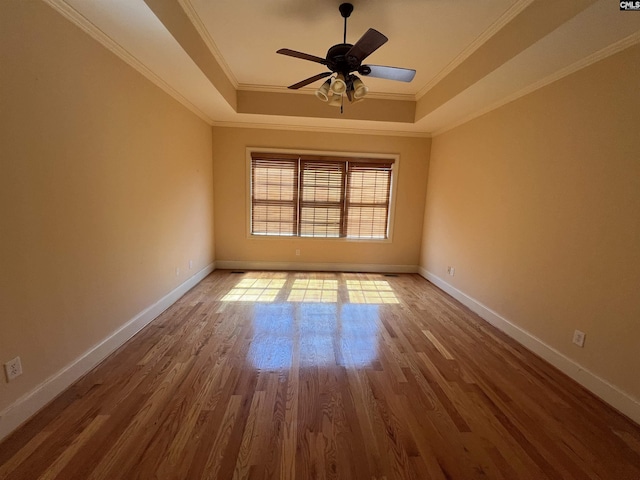 218 Scarborough Way, Lexington, SC 29072 - empty room with a raised ceiling, wood finished floors, a ceiling fan, and ornamental molding