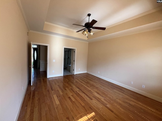 218 Scarborough Way, Lexington, SC 29072 - unfurnished room with a raised ceiling, wood finished floors, ornamental molding, and ceiling fan