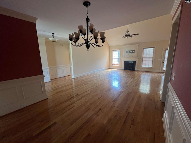218 Scarborough Way, Lexington, SC 29072 - unfurnished living room with a fireplace, ceiling fan, a chandelier, wood finished floors, and a decorative wall